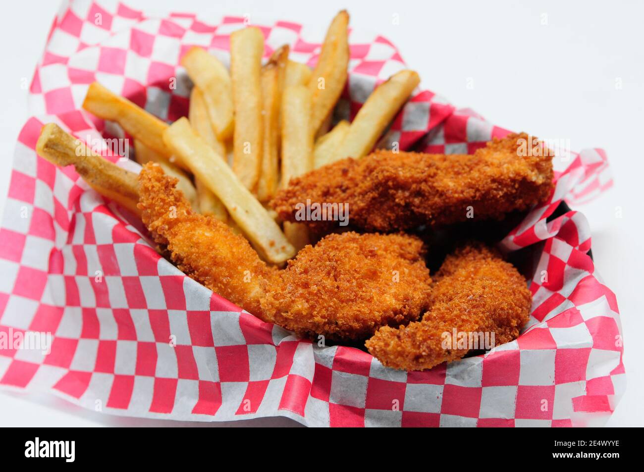 breaded chicken strips with french fries and dipping sauce in a Stock