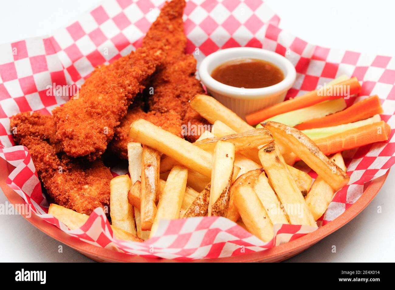 breaded chicken strips with french fries and dipping sauce in a Stock