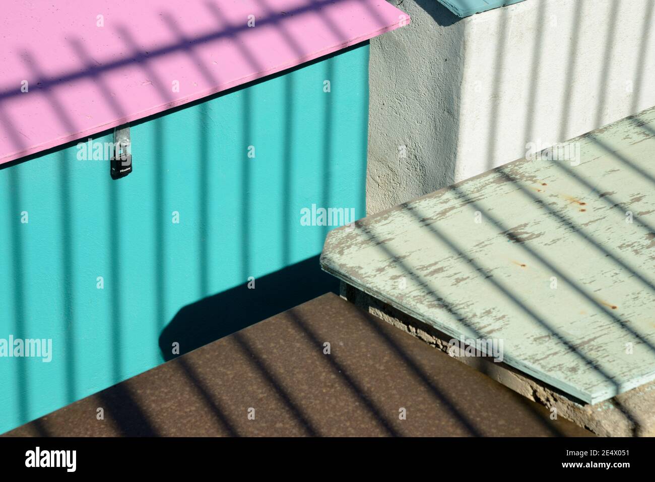 Geometric Minimalism or Colourful Shapes on Colourful Sheds & Shadow Patterns or Pattern of Railings Stock Photo