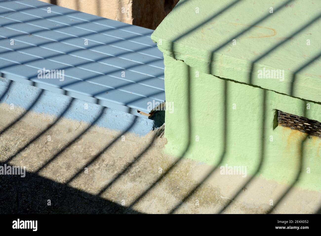 Geometric Minimalism or Colourful Shapes on Colourful Sheds & Shadow Patterns or Pattern of Railings Stock Photo