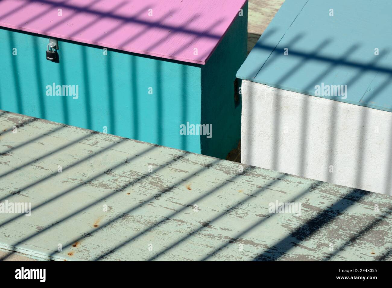 Geometric Minimalism or Colourful Shapes on Colourful Sheds & Shadow Patterns or Pattern of Railings Stock Photo