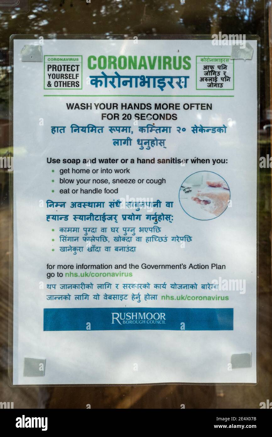 Bilingual coronavirus safety notice about hand washing in English and Nepali, Rushmoor Borough Council, Aldershot, Hampshire, UK Stock Photo