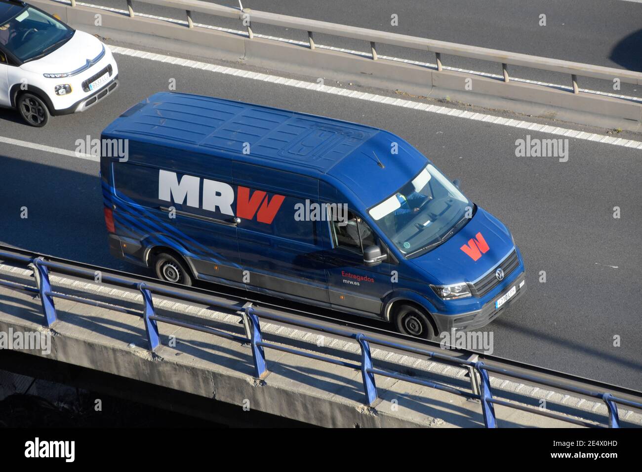 MRW fast delivery van in a highway. Barcelona, Catalonia, Spain. Stock Photo