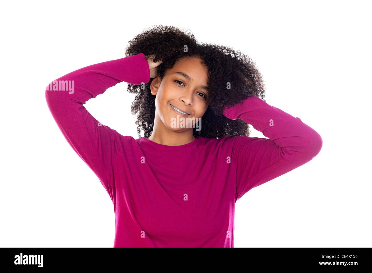 Beautiful teenager girl with pink sweater isolated on a white