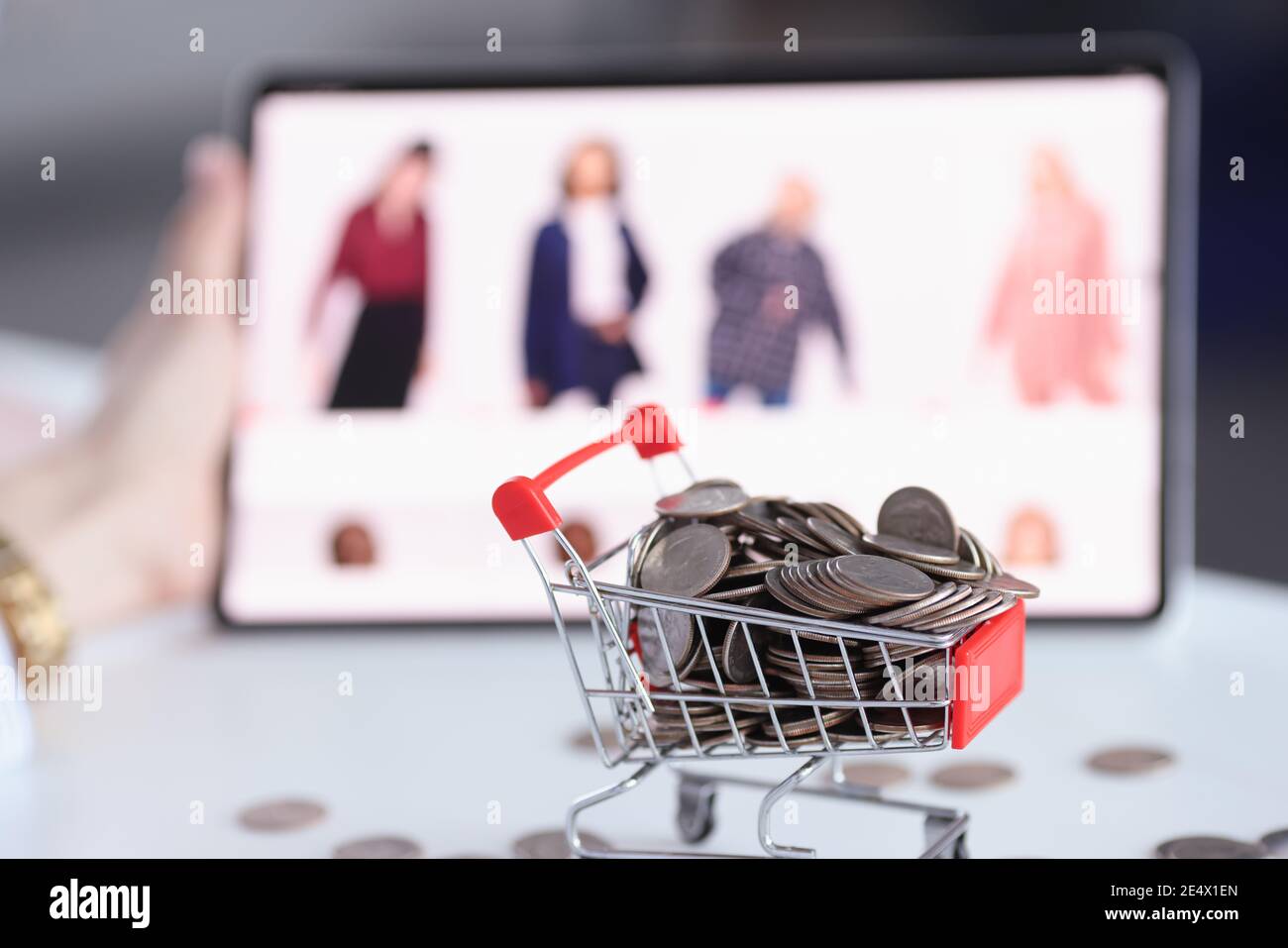 Full basket of coins on background of an online store with goods Stock  Photo - Alamy