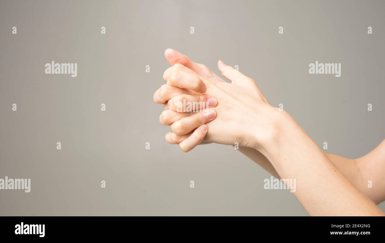 Parkinson's disease symptoms. Close up of tremor (shaking) hands of