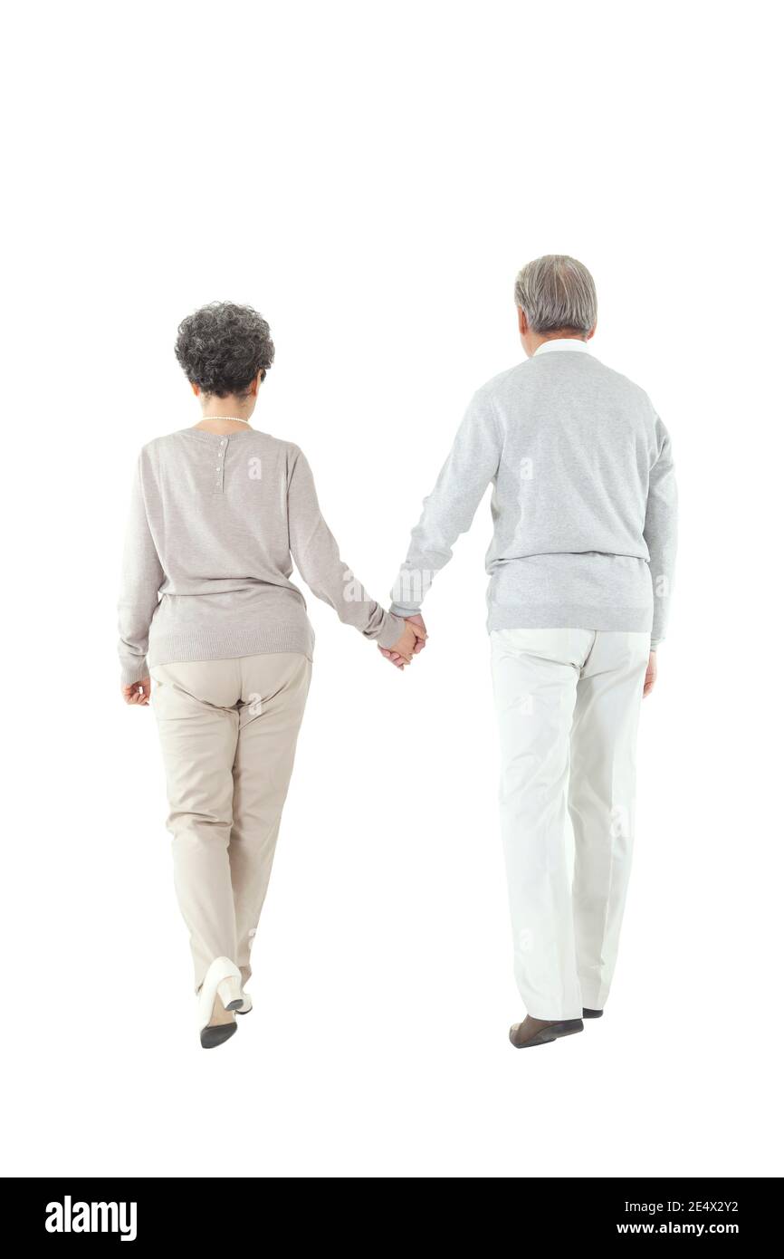Oriental old couple walking hand in hand high quality photo Stock Photo
