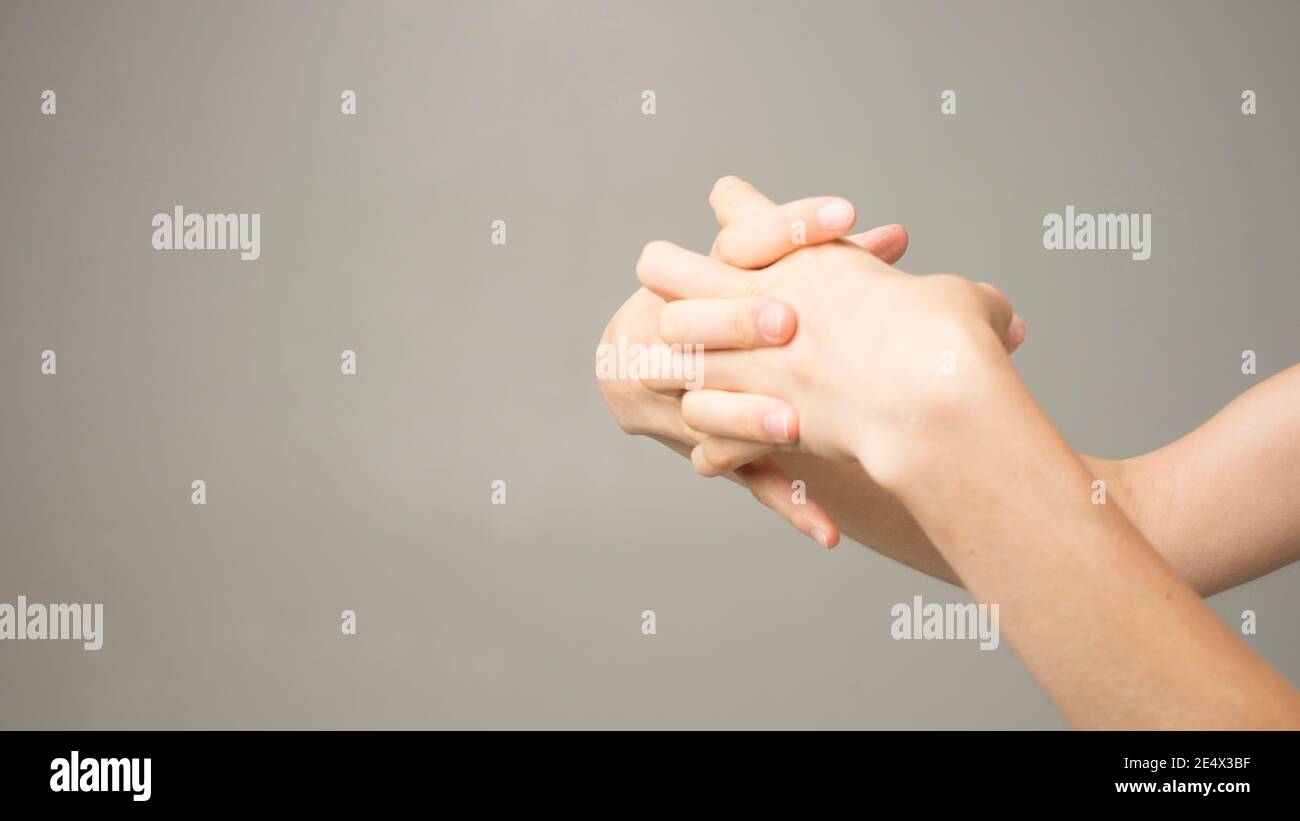 Parkinson's disease symptoms. Close up of tremor (shaking) hands of