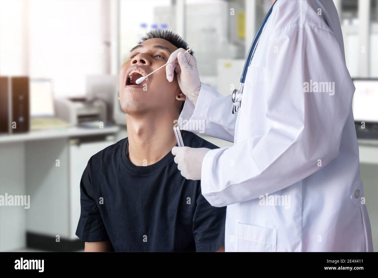 coronavirus COVID-19 test. doctor holding test tube, use cotton swab to collect secretion sample from patient for PCR diagnostic covid virus infection Stock Photo