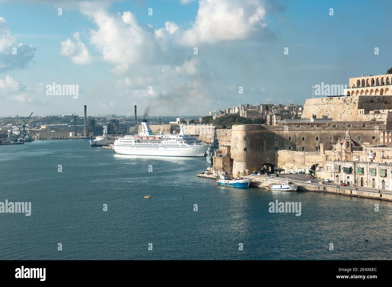 Valletta, Malta - November 27, 2011: view of Valletta and Grand Harbour with a passenger ship moored Stock Photo