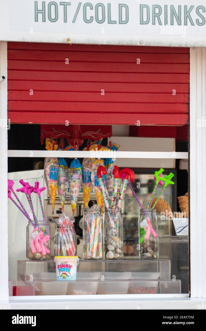 11-11-2019 Portsmouth, Hampshire, UK A Kiosk at the seaside selling sticks of rock and other sweets Stock Photo