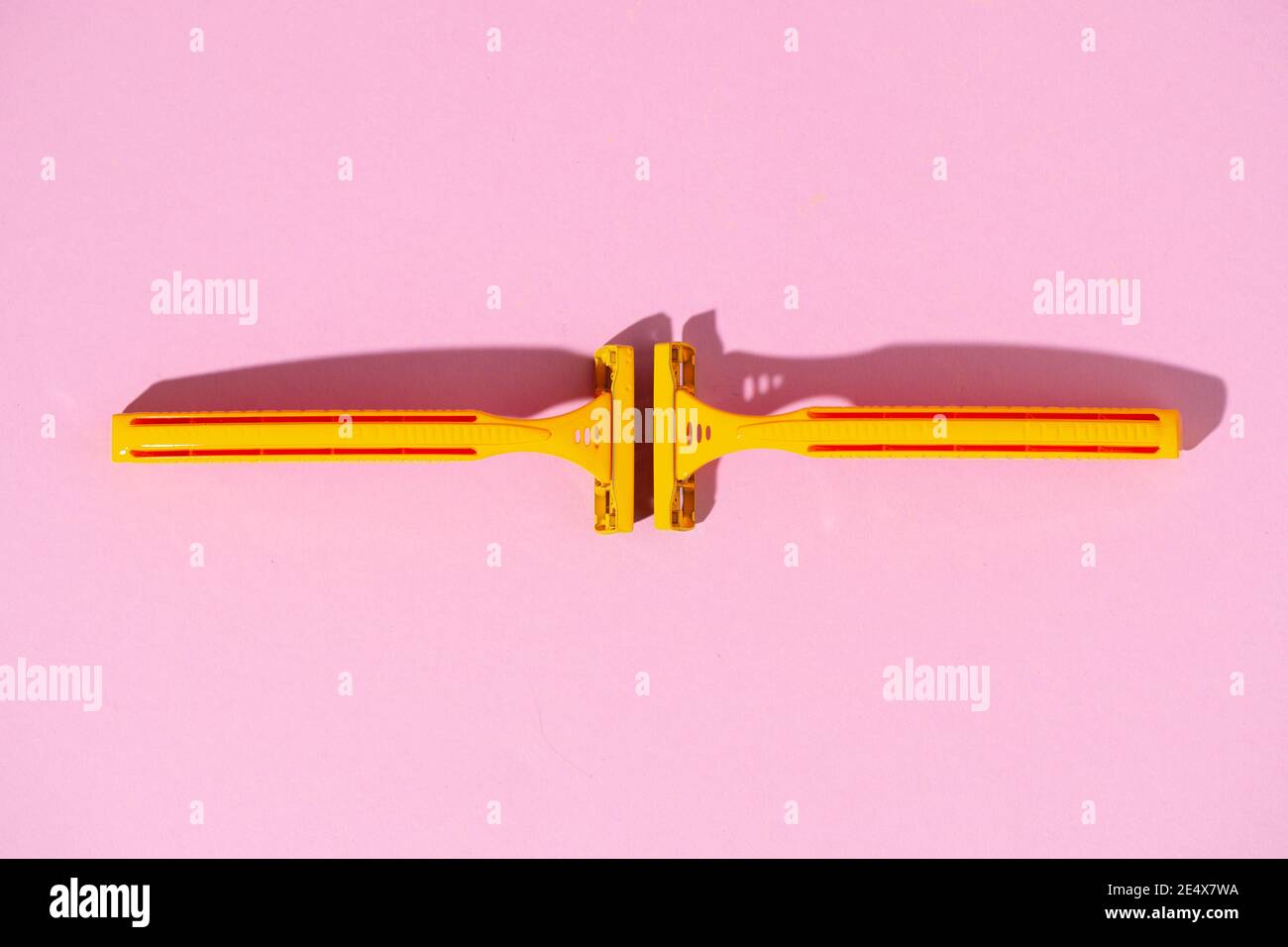 Yellow disposable razors on pink background, studio shot Stock Photo ...