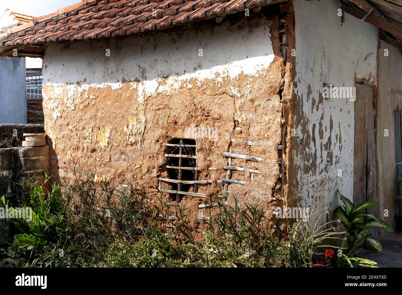 This is a traditional house in rural Vietnam. It had tiled roofs, clay