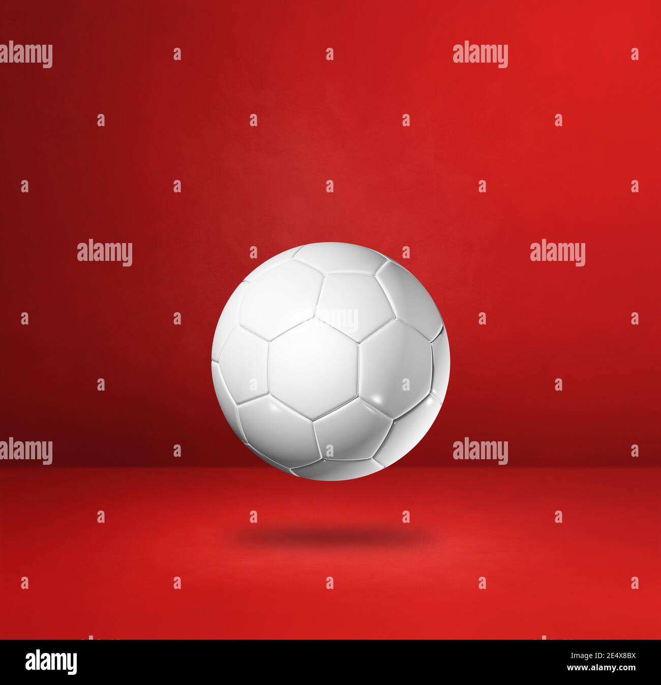White soccer ball isolated on a red studio background. 3D illustration