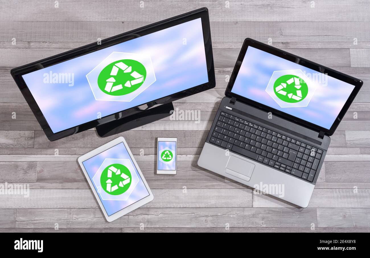 Recycling concept shown on different information technology devices Stock Photo