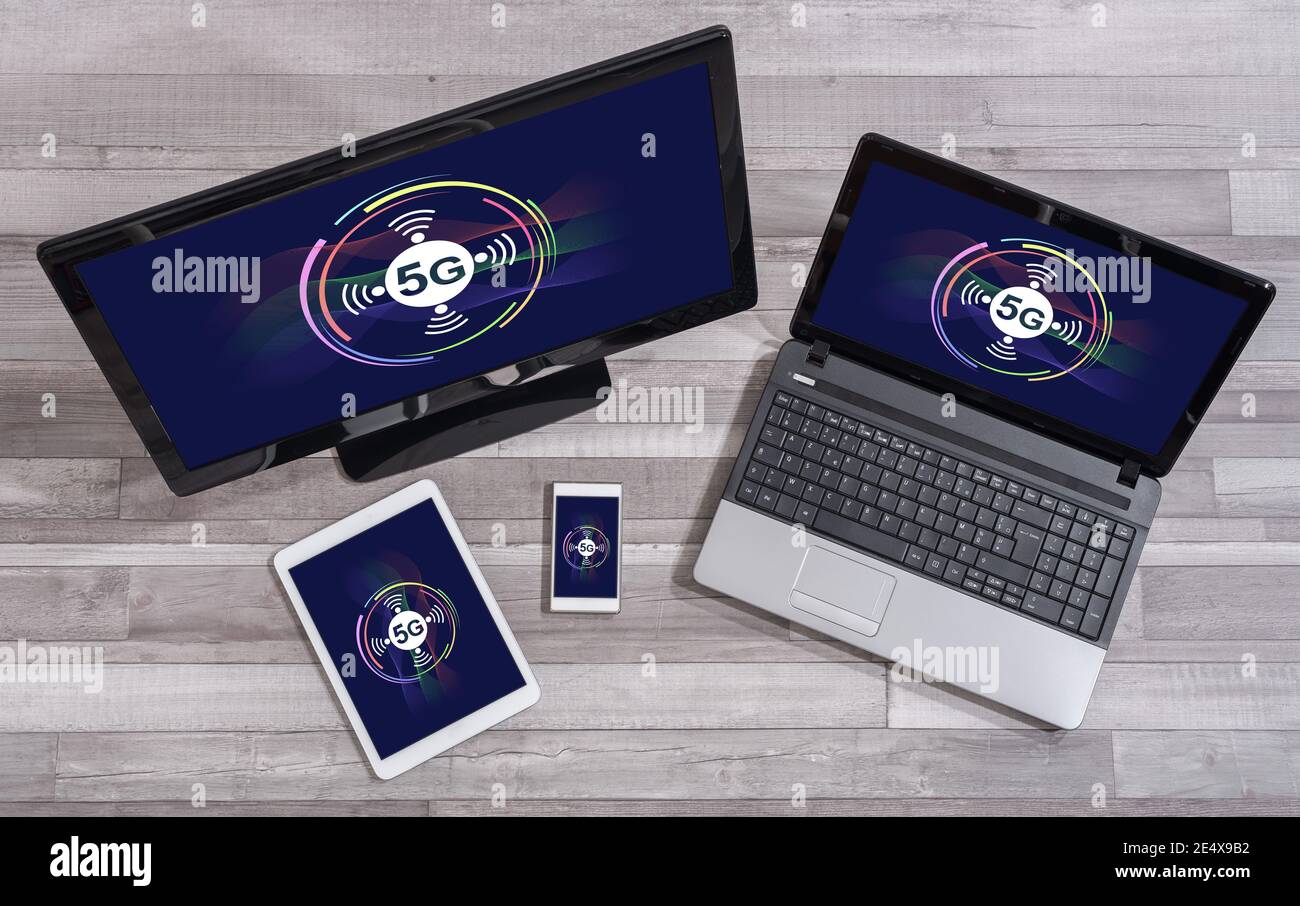 5g concept shown on different information technology devices Stock Photo