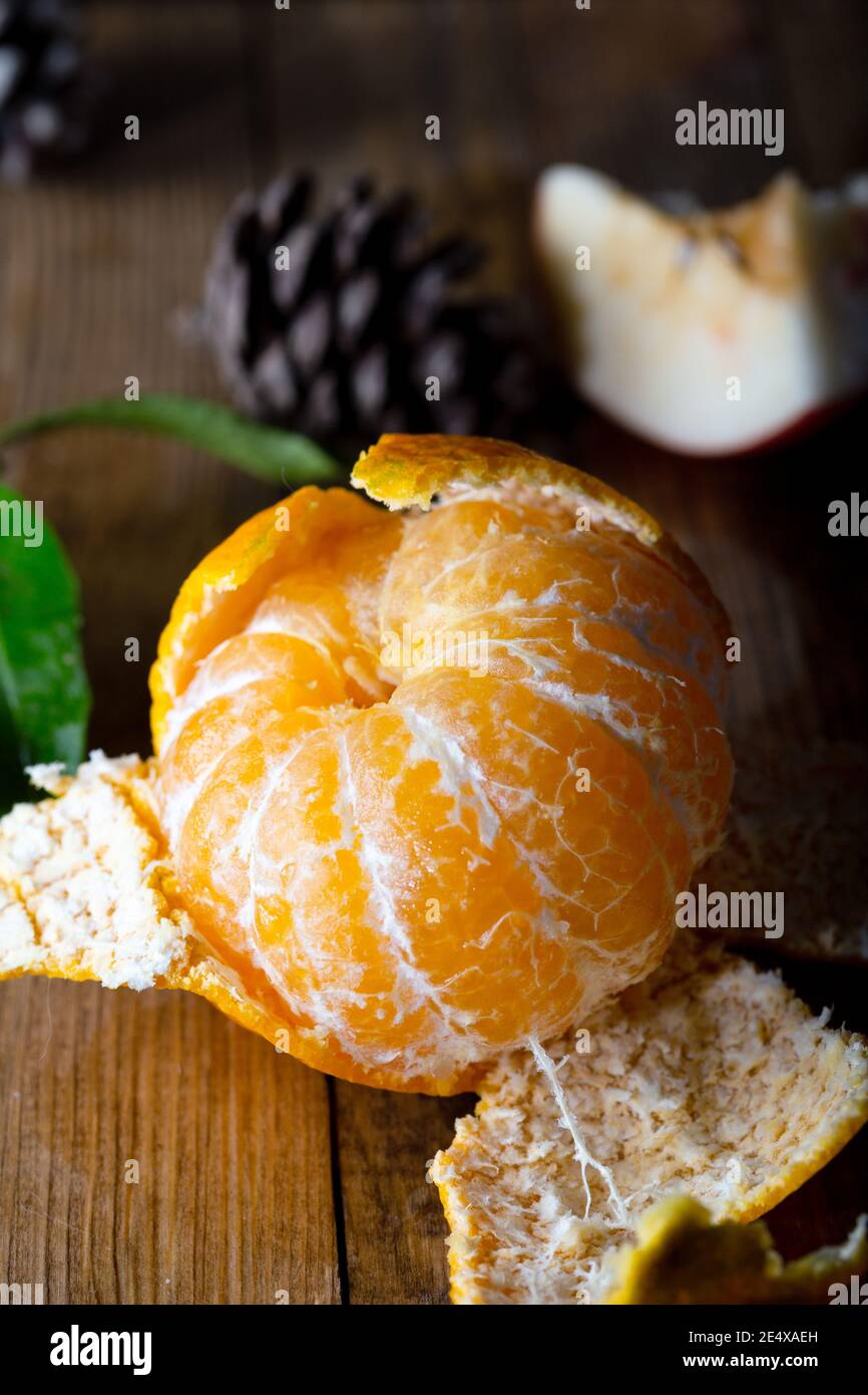 https://c8.alamy.com/comp/2E4XAEH/ripe-tasty-tangerin-on-wooden-background-fresh-tangerine-peeled-on-wooden-table-2E4XAEH.jpg