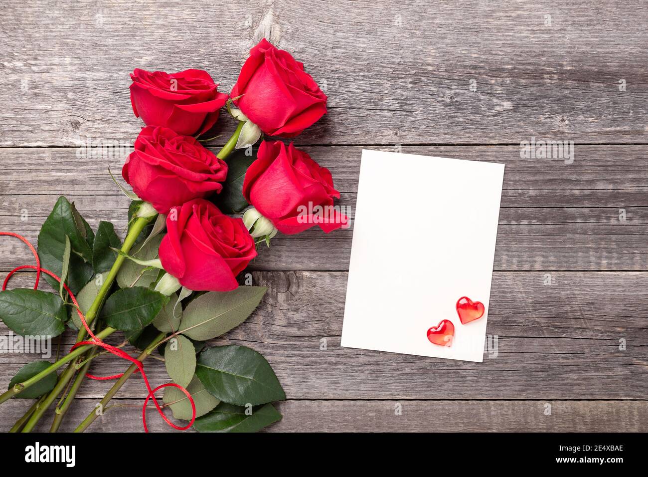 Valentine's day greeting card with red rose flowers bouquet on a ...