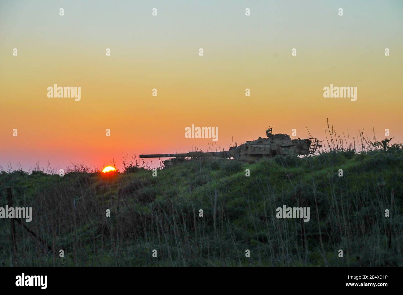 Silhouette of an Israeli tank at sunset Stock Photo