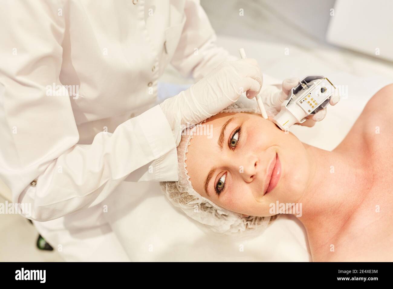 Ultrasound skin tightening on a woman's face in aesthetic surgery Stock ...