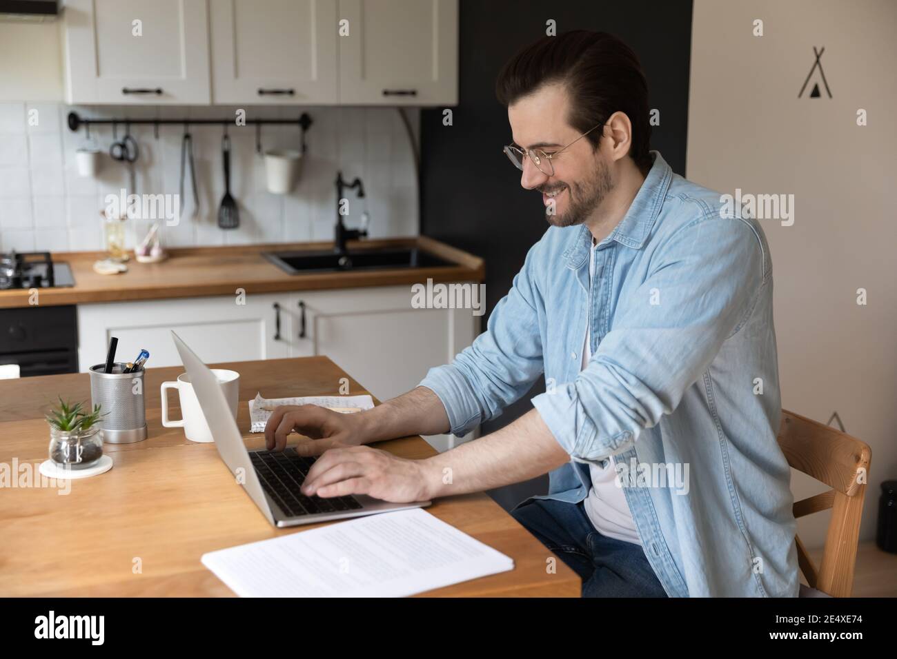 Confident young man student getting professional education via e-learning platform Stock Photo