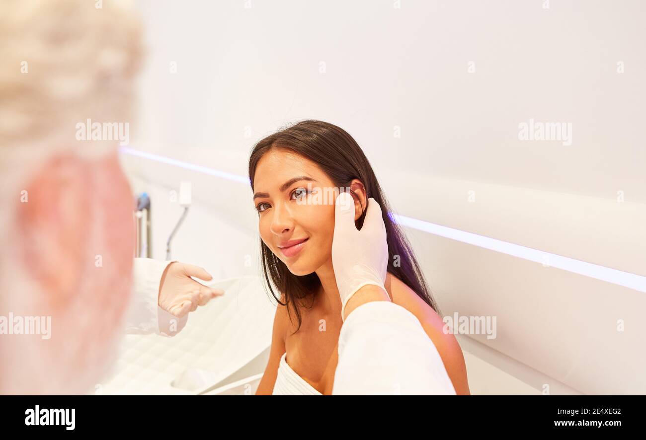 The patient is examined by a dermatologist or plastic surgeon Stock Photo