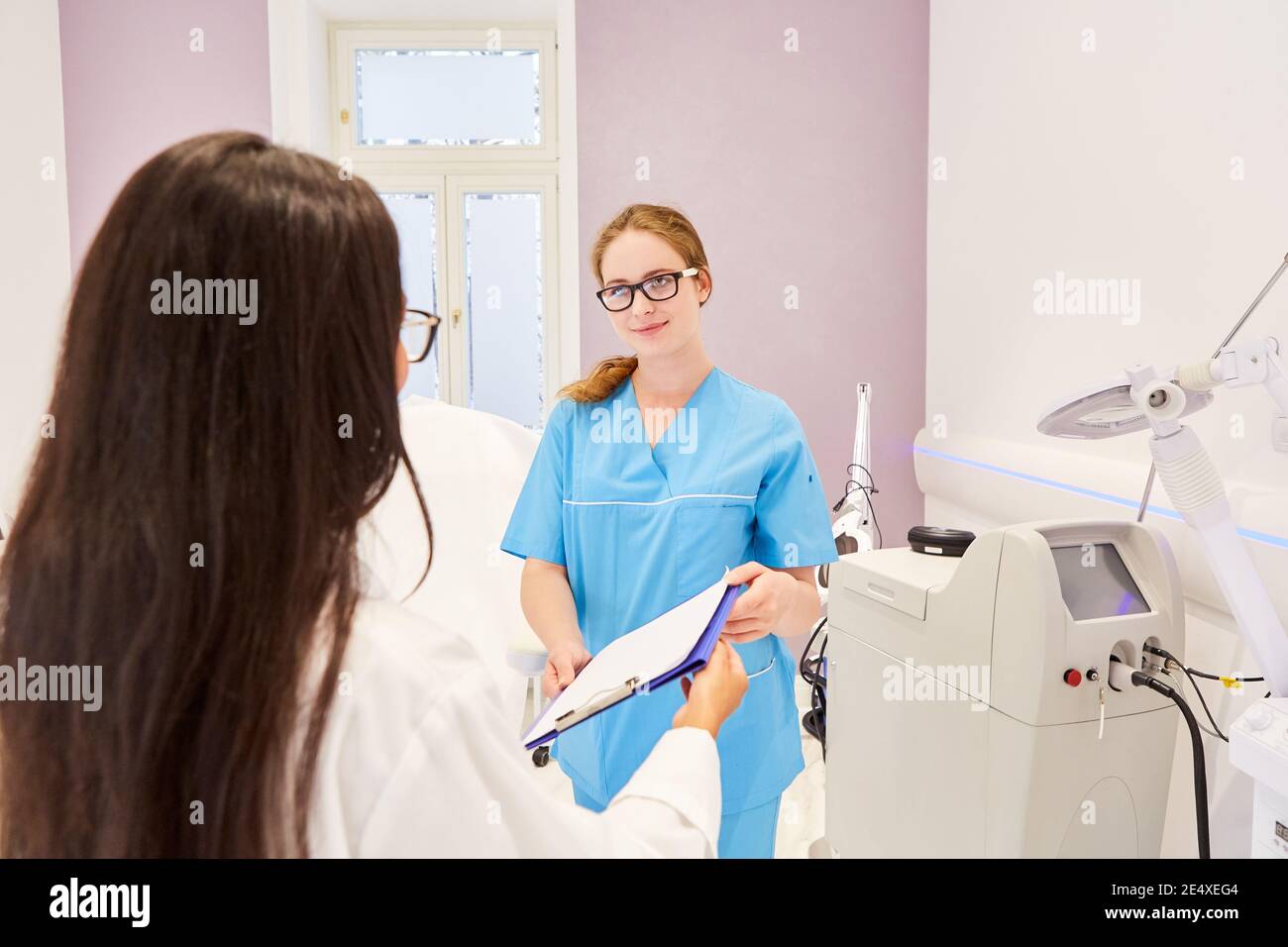 The doctor and the OR nurse work together in the beauty clinic or in the doctor's office Stock Photo