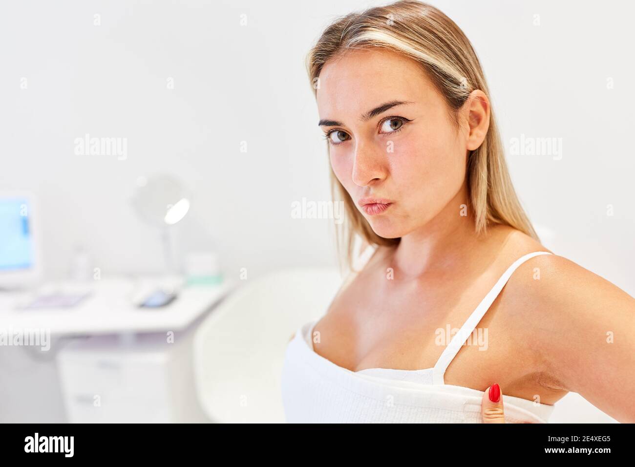 Young patient in the cosmetic studio or the beauty clinic before the plastic surgery Stock Photo