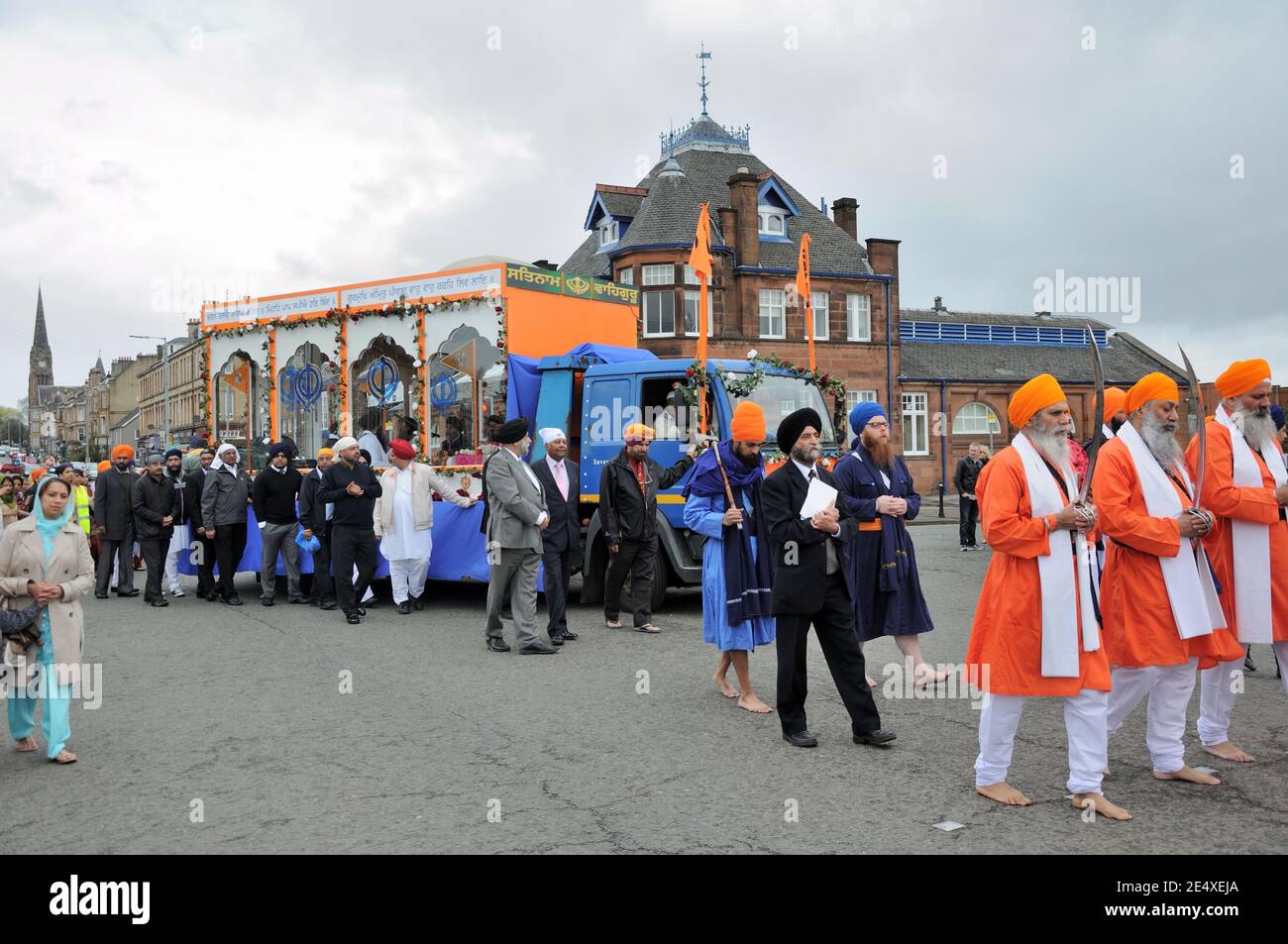 Sikhs parade through Pollokshields celebrating Vaisakhi in Glasgow, Scotland, UK Stock Photo