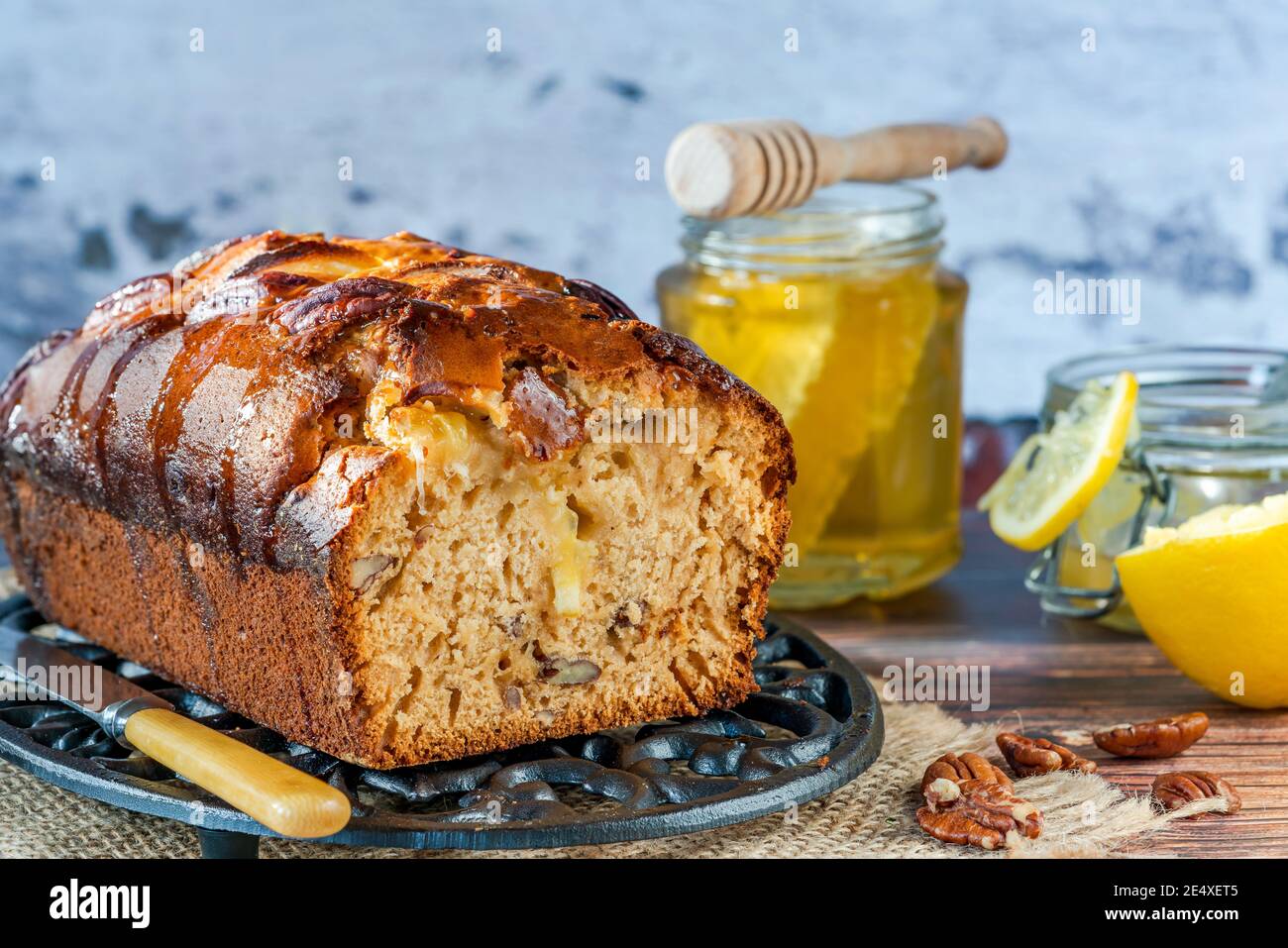 Honey, lemon and pecan nut loaf on a table Stock Photo