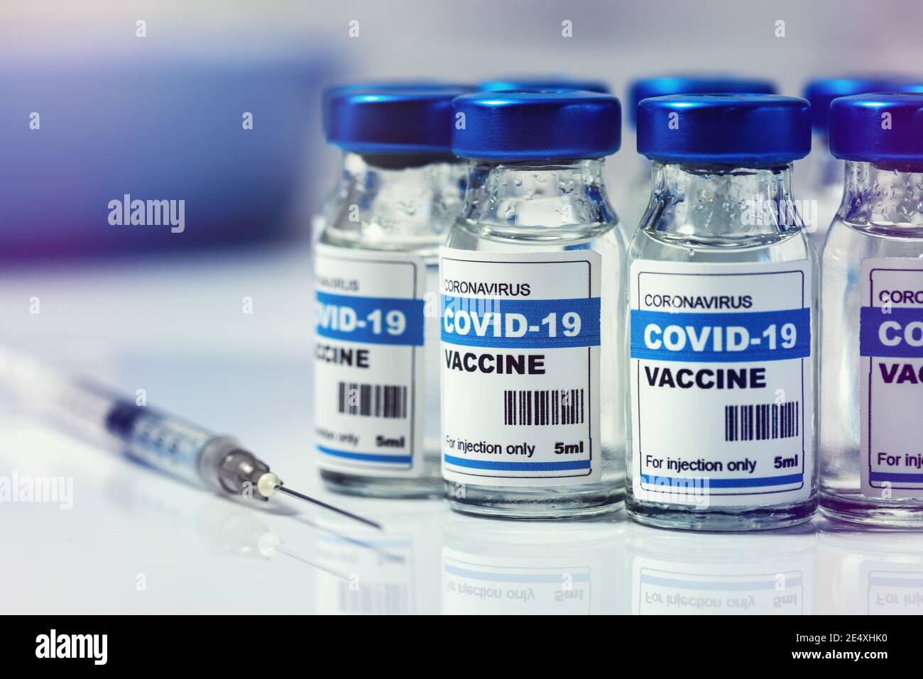 covid-19 vaccine - group of coronavirus vaccination vials and syringe Stock Photo