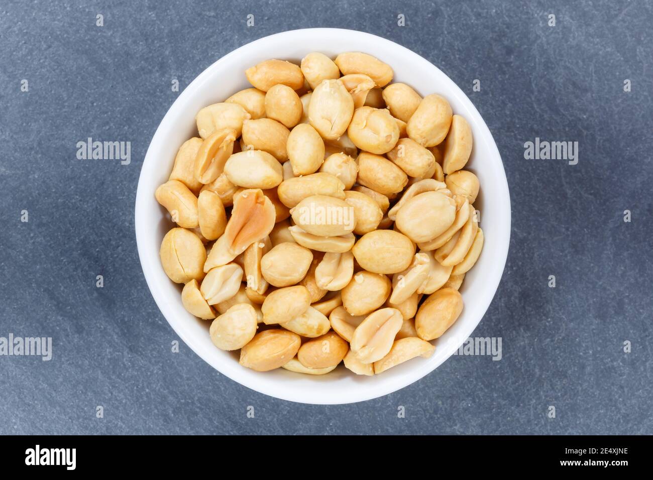 Peanuts nuts from above bowl on a slate Stock Photo