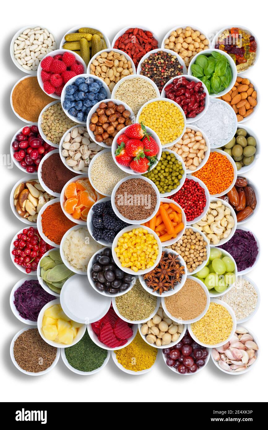 Fruits and vegetables spices ingredients cooking bowls berries portrait format food from above fruit Stock Photo