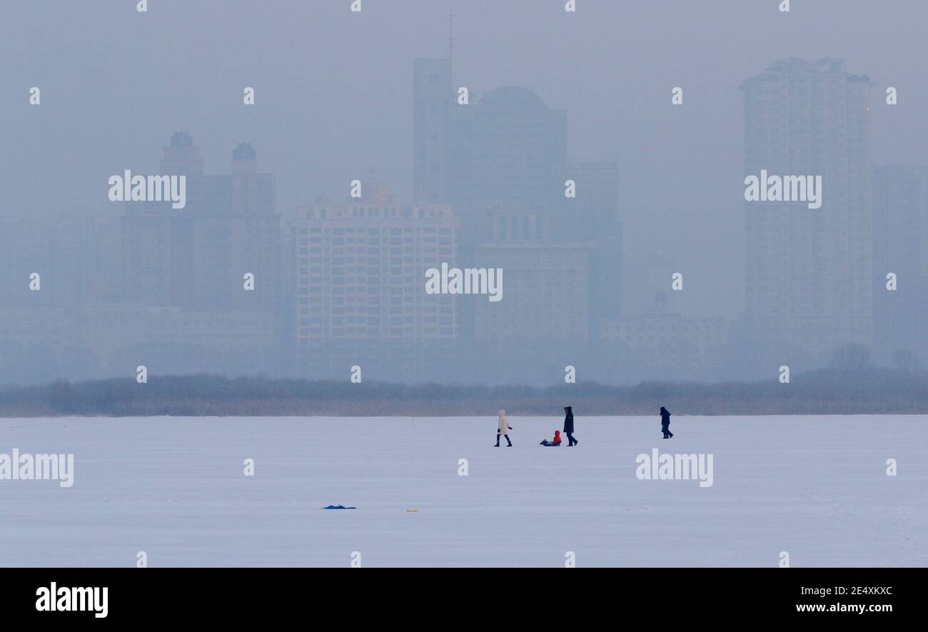 Buildings located in the downtown are covered by severe haze in Harbin city, northeast China¯s Heilongjiang province, 24 January 2021. *** Local Capti Stock Photo