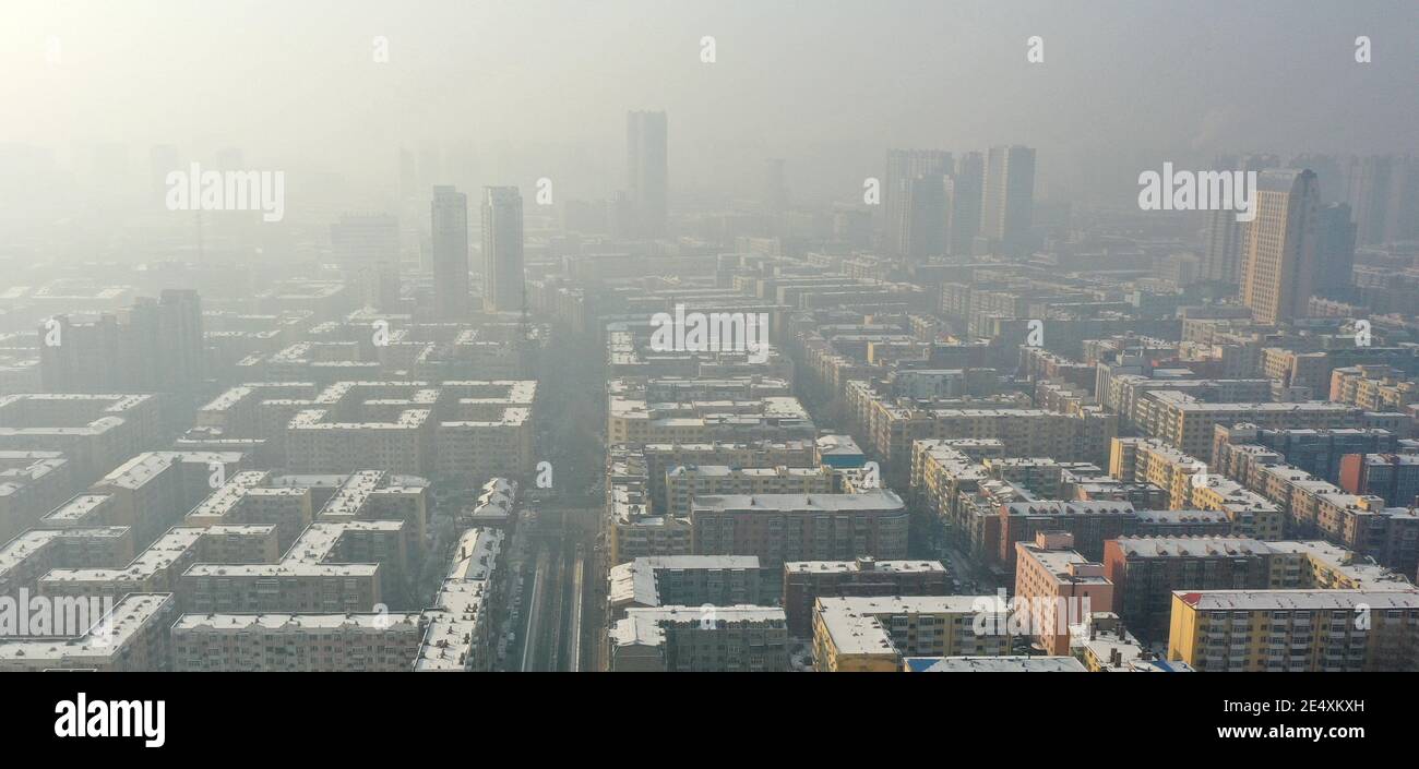 An aerial view of buildings located in the downtown covered by severe haze in Harbin city, northeast China¯s Heilongjiang province, 24 January 2021. * Stock Photo