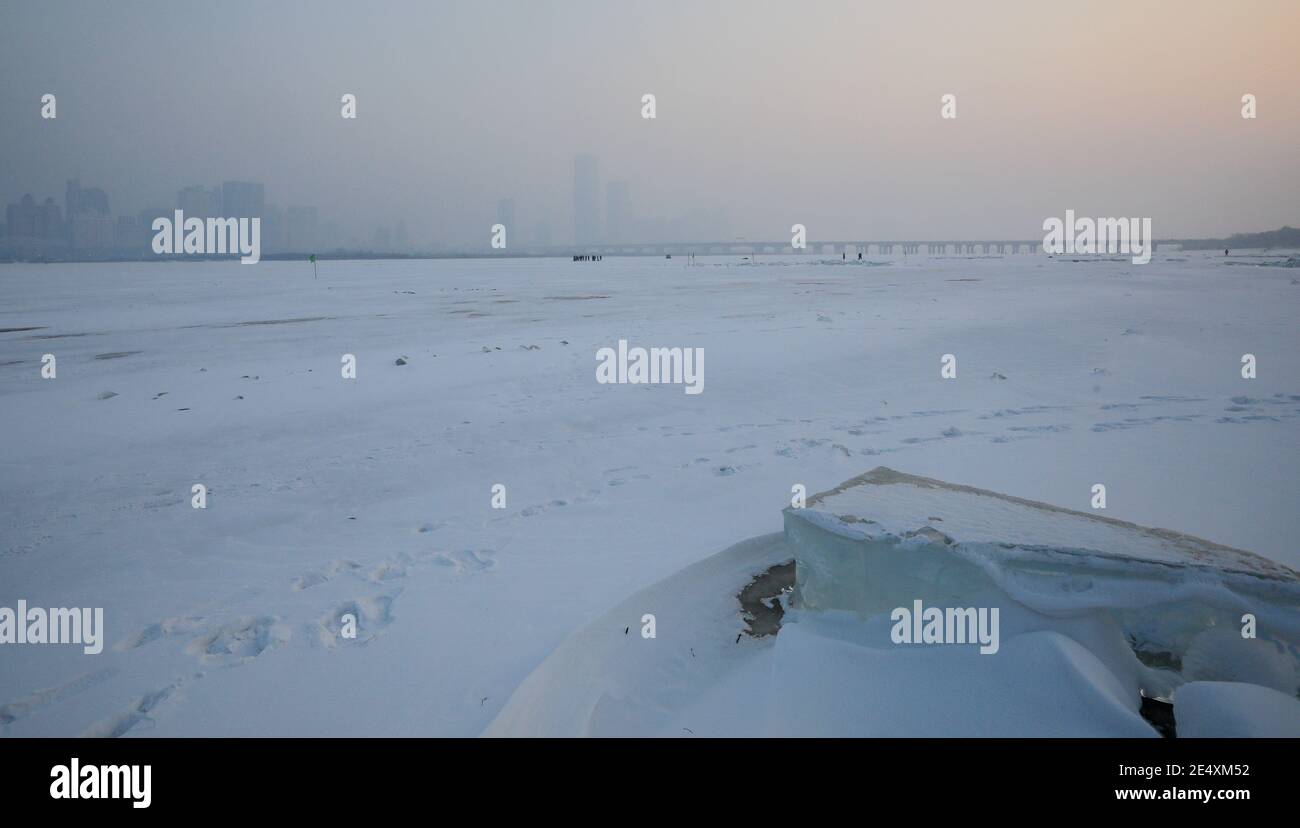 Buildings located in the downtown are covered by severe haze in Harbin city, northeast China¯s Heilongjiang province, 24 January 2021. *** Local Capti Stock Photo