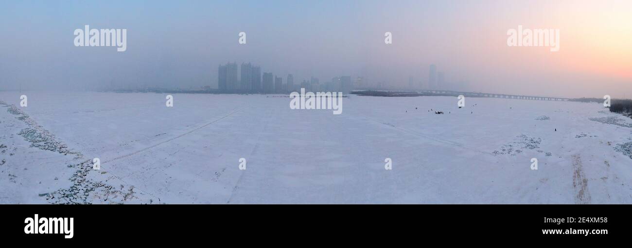 Buildings located in the downtown are covered by severe haze in Harbin city, northeast China¯s Heilongjiang province, 24 January 2021. *** Local Capti Stock Photo
