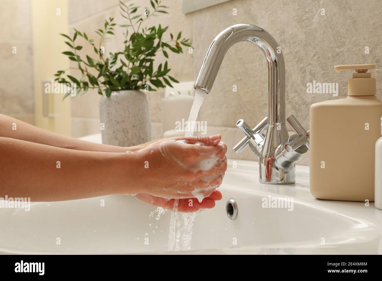 Woman washing hands under the water tap in sink Stock Photo - Alamy
