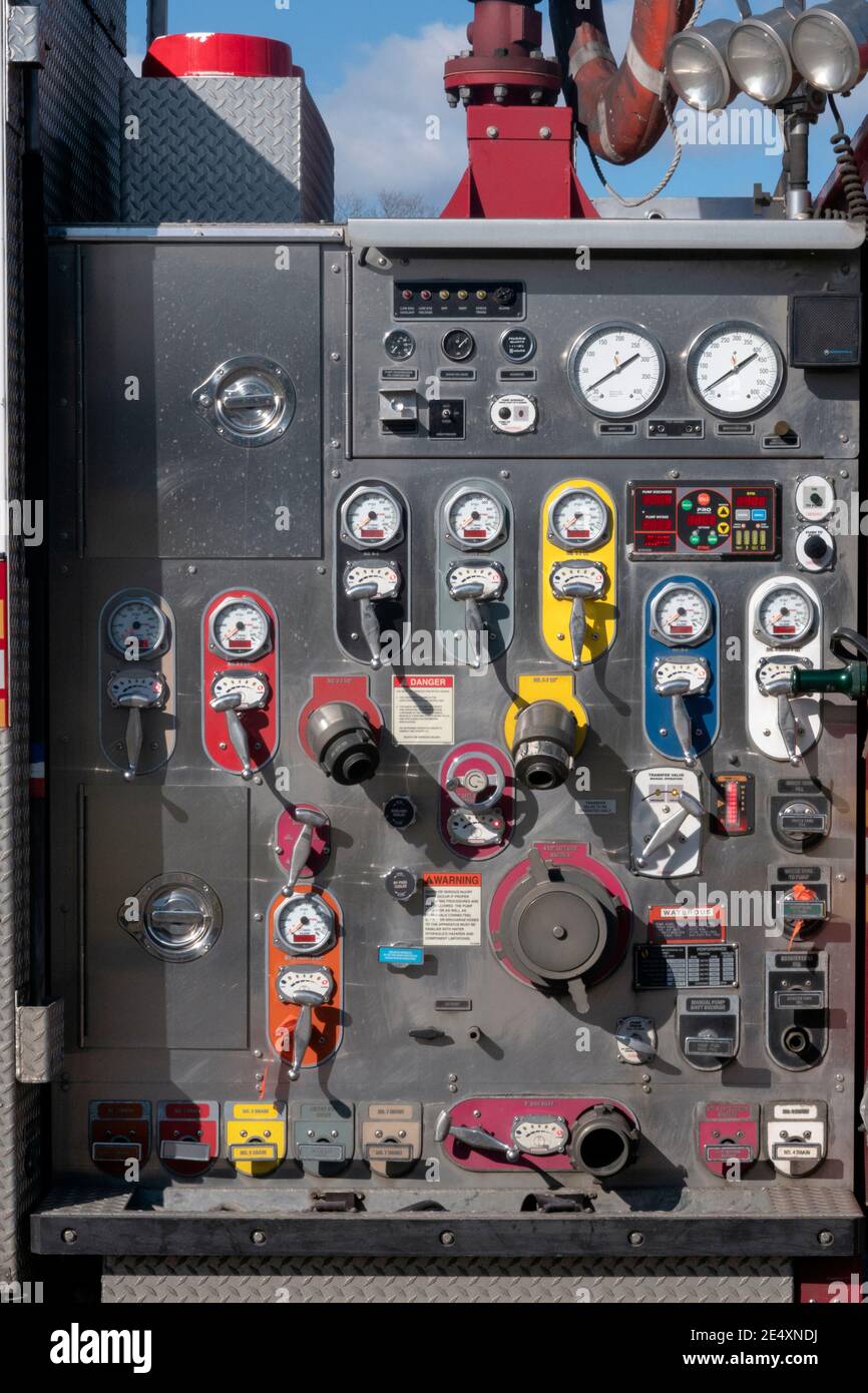 Controls and connection points on the side of a new FDNY firetruck. In Flushing, Queens, New York City. Stock Photo