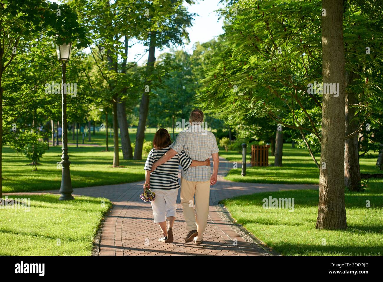Two woman walking backview hi-res stock photography and images - Alamy