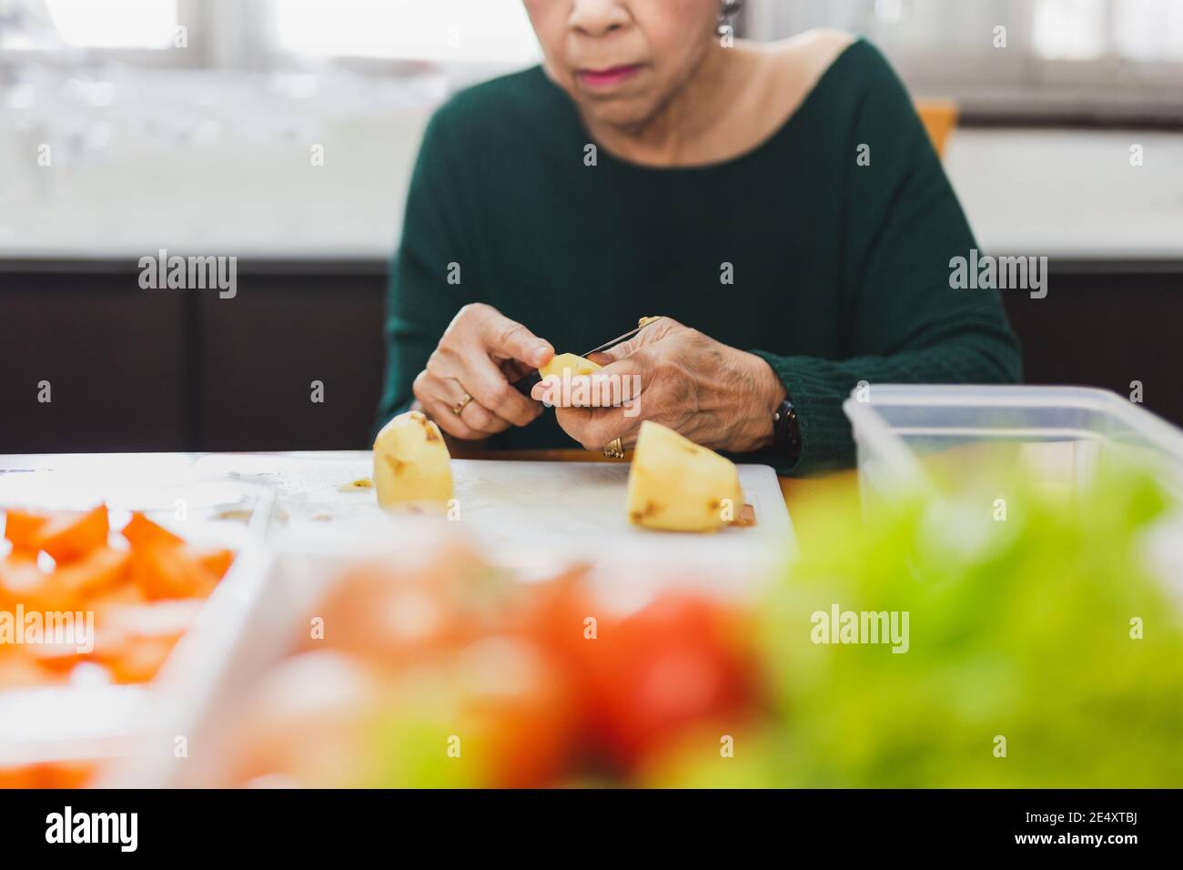 Hands adult woman peeling hi-res stock photography and images - Alamy