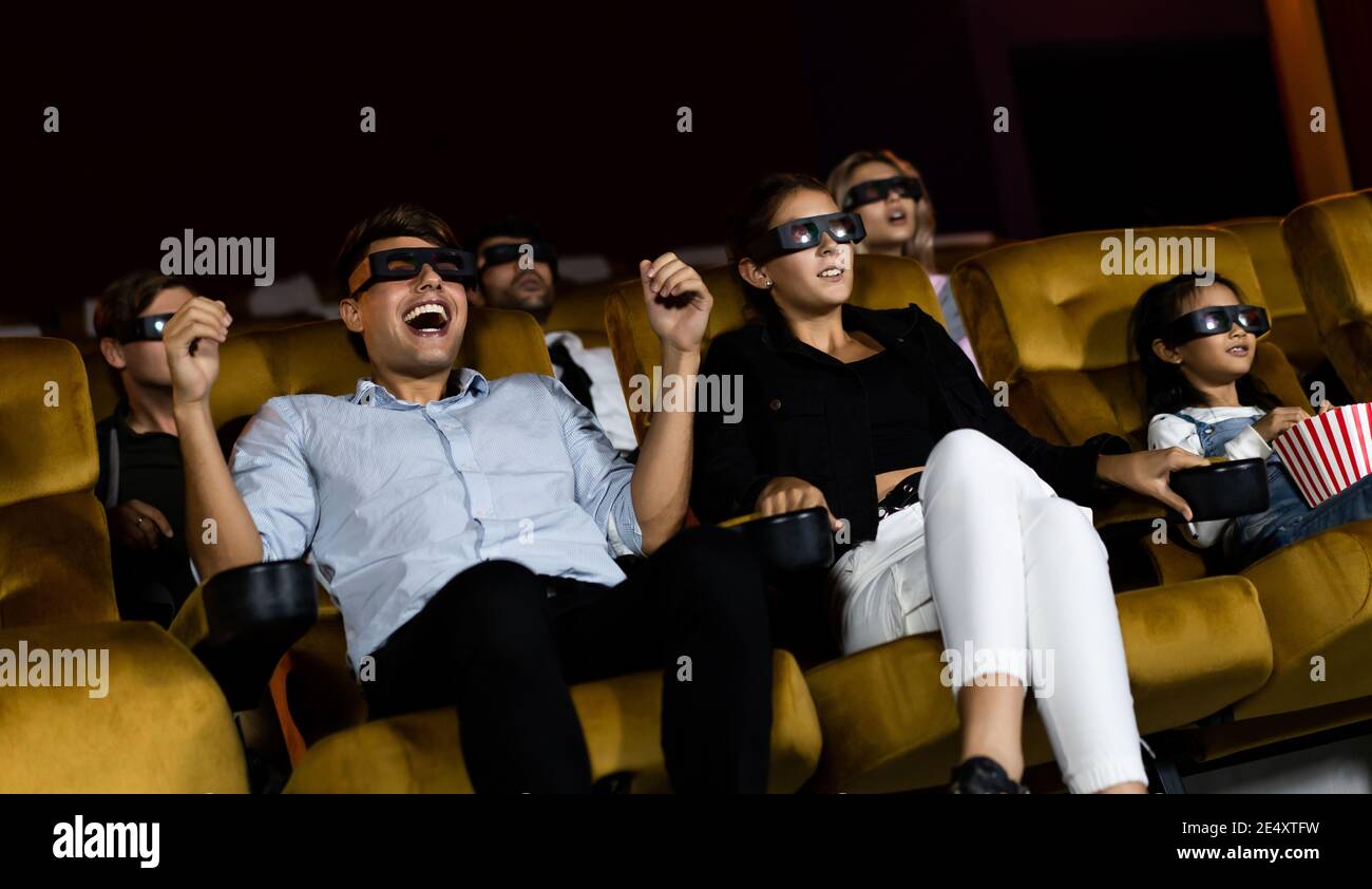 Group of people watch movie with 3D glasses in cinema theater with interest  looking at the screen, exciting and enjoy Stock Photo - Alamy
