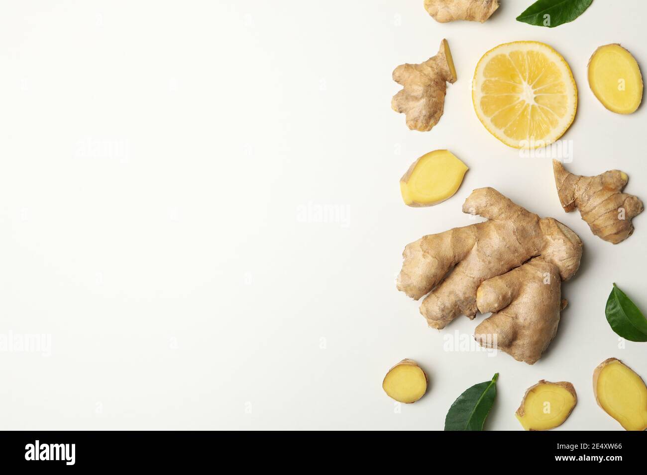 Fresh ginger and lemon on white in top view, an immunity boosting ginger and lemon flat lay Stock Photo