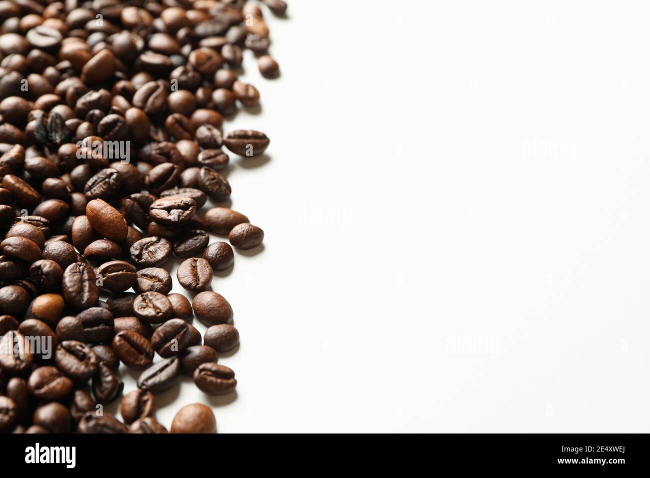 Roasted coffee beans on white background, space for text Stock Photo ...