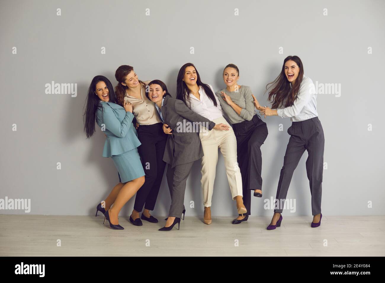 Team of excited young business women having fun and celebrating success together Stock Photo