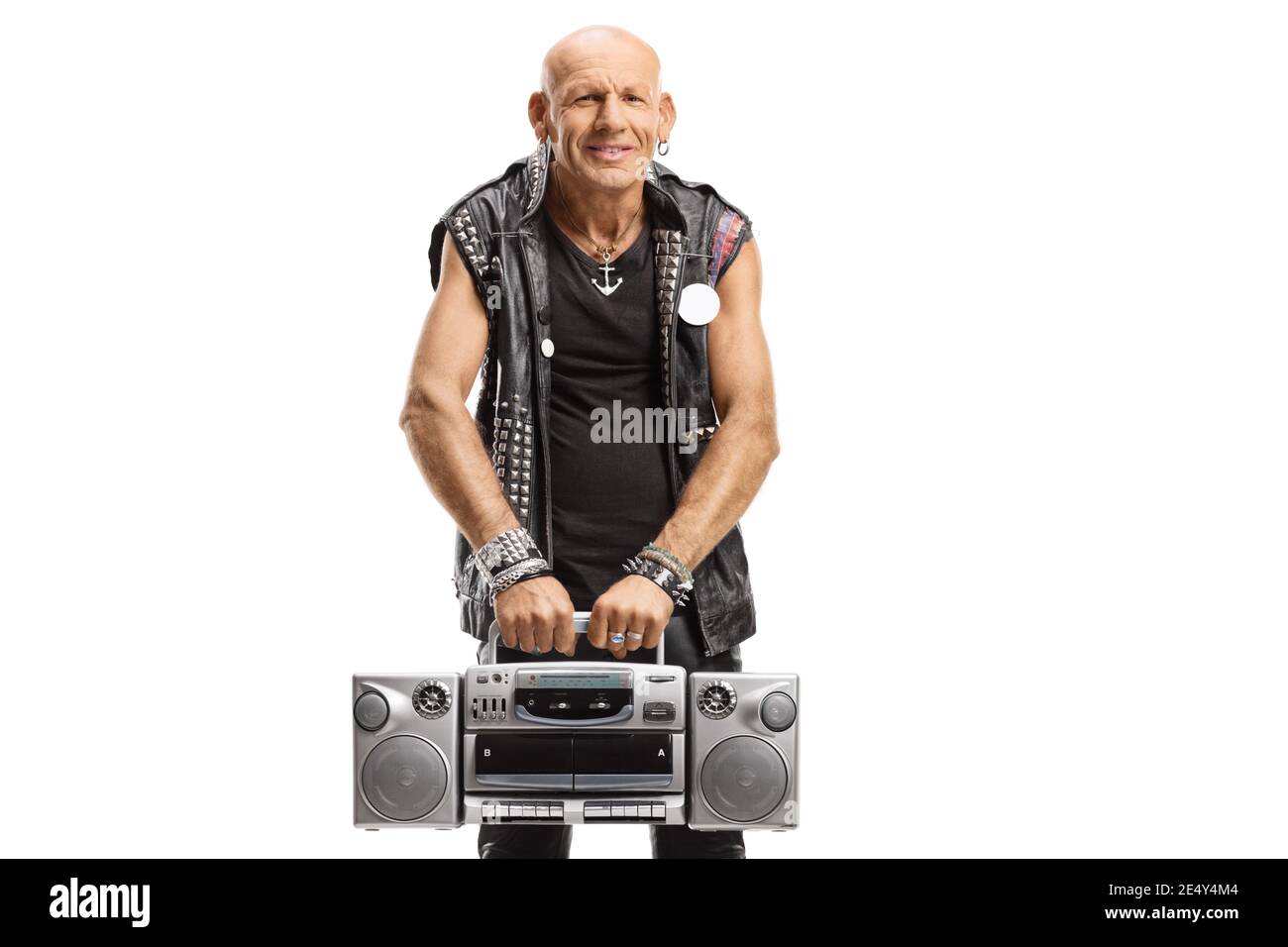 Punk rocker in leather outfit holding a boombox radio isolated on white background Stock Photo