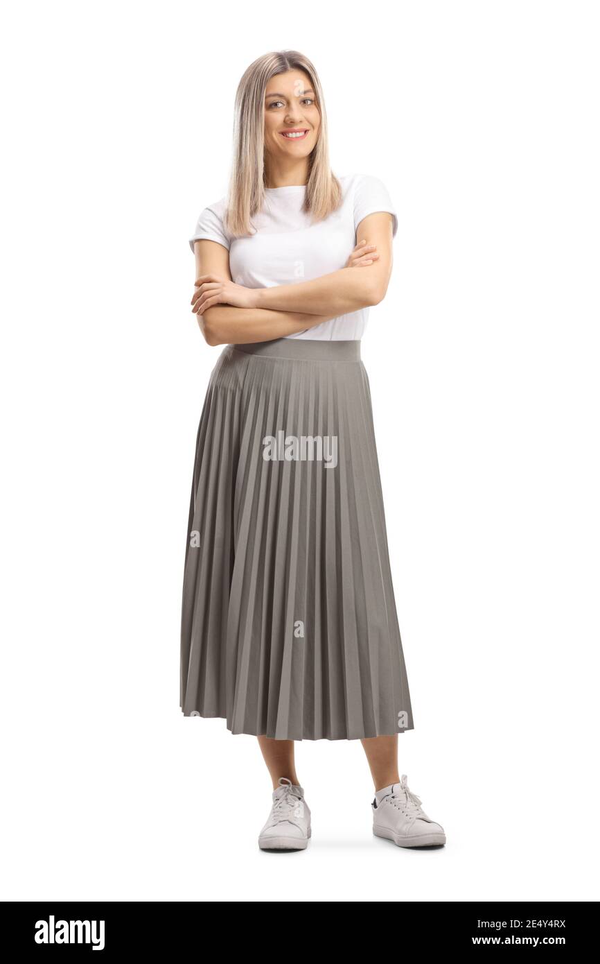 Full length portrait of a young blond woman in a pleated skirt isolated on white background Stock Photo