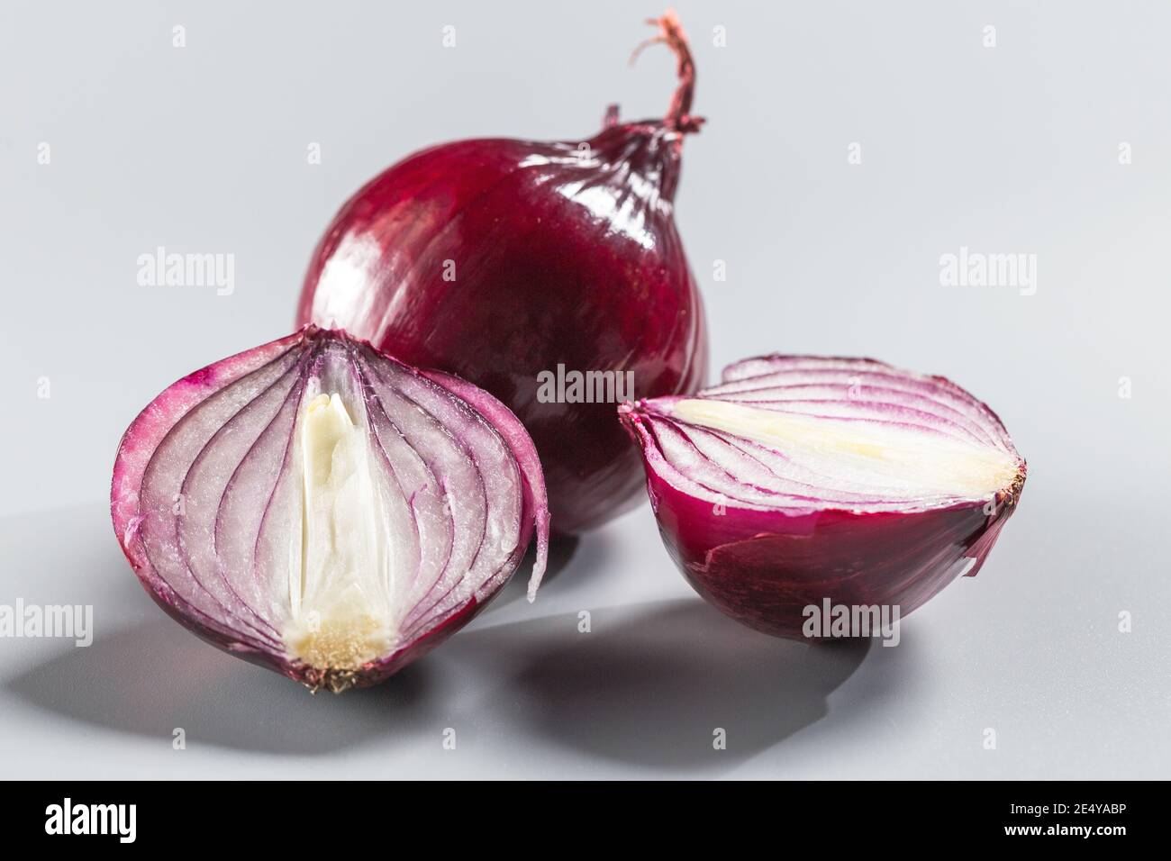 Red onions isolated on gray background. Stock Photo