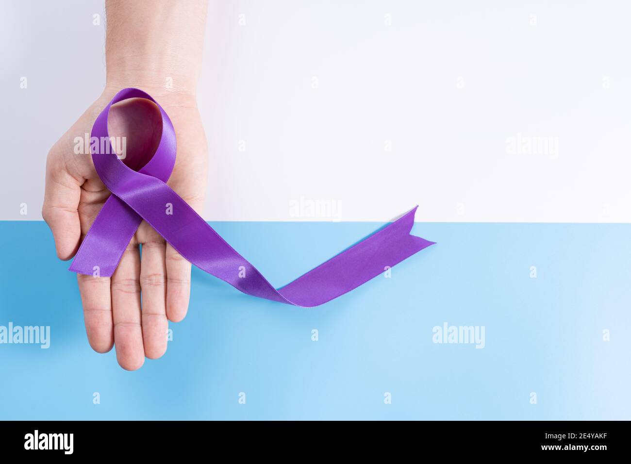 World cancer day, hands holding purple ribbon on with and blue ...