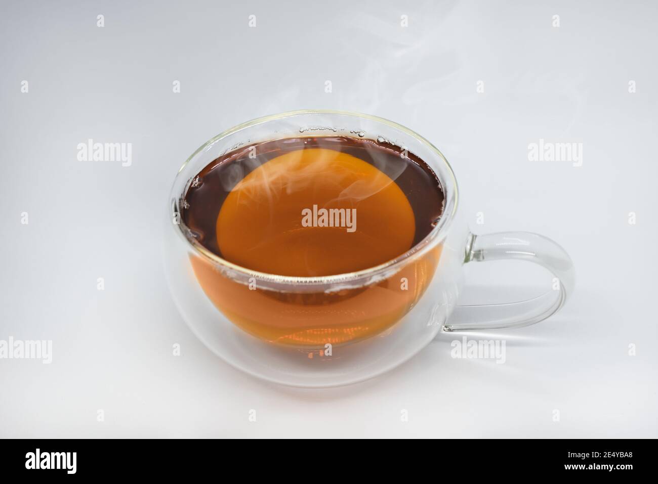 Glass cup of black tea. Isolated on white background Stock Photo